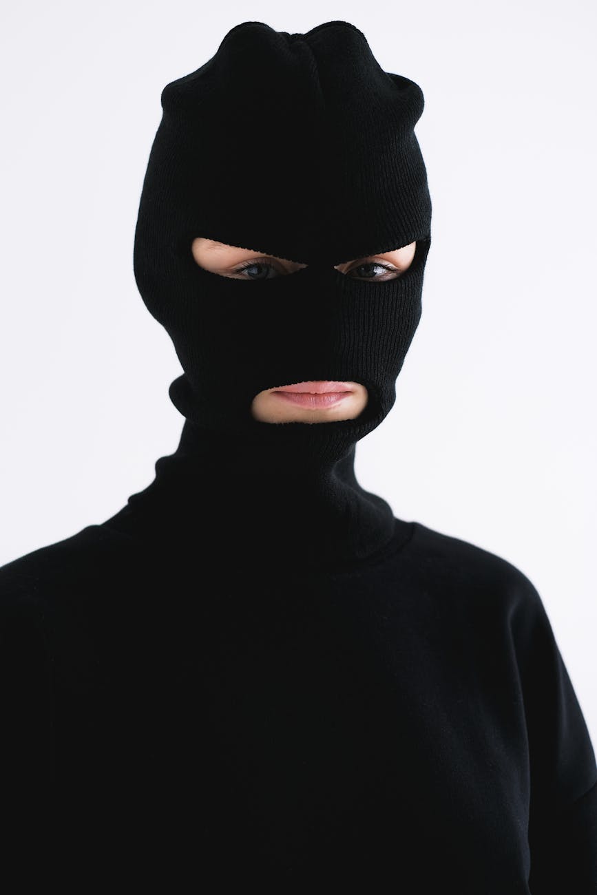 close up shot of a person wearing a robber mask