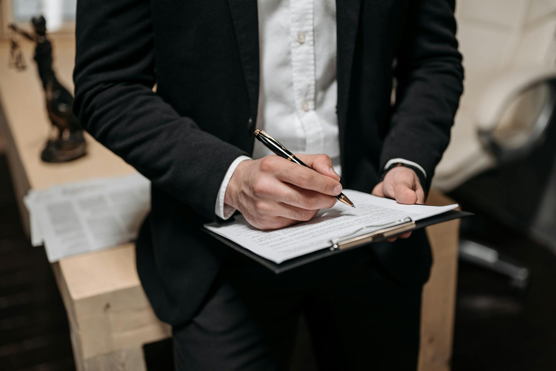 close up photo of a person holding a clipboard